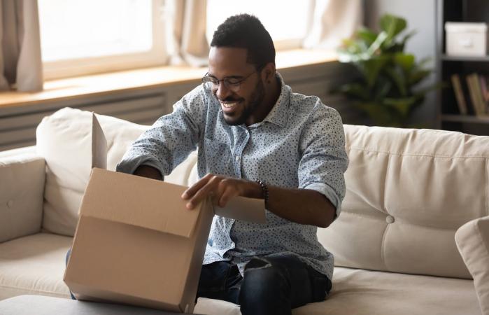 man opening gift