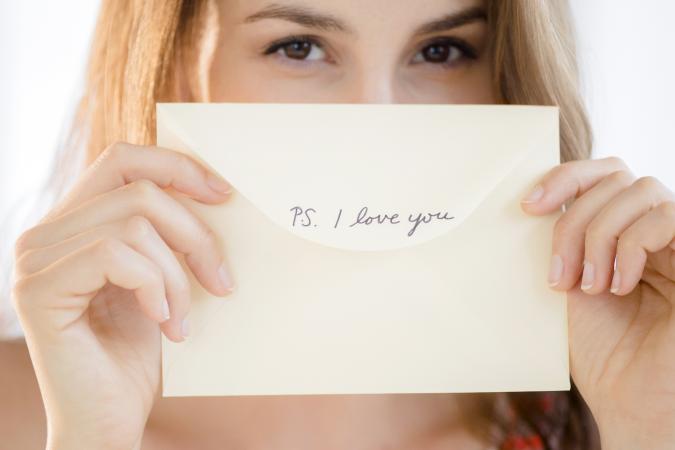 Woman holding a love note