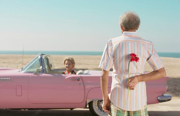 man surprising wife with flower