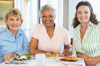 Mature women sharing a meal