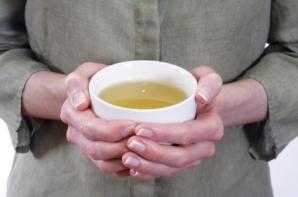 Person holding cup of fu ling tea