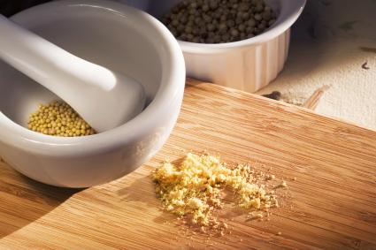 Mortar and pestle with mustard seeds
