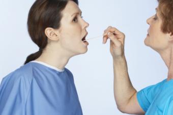 Doctor examining patient's mouth