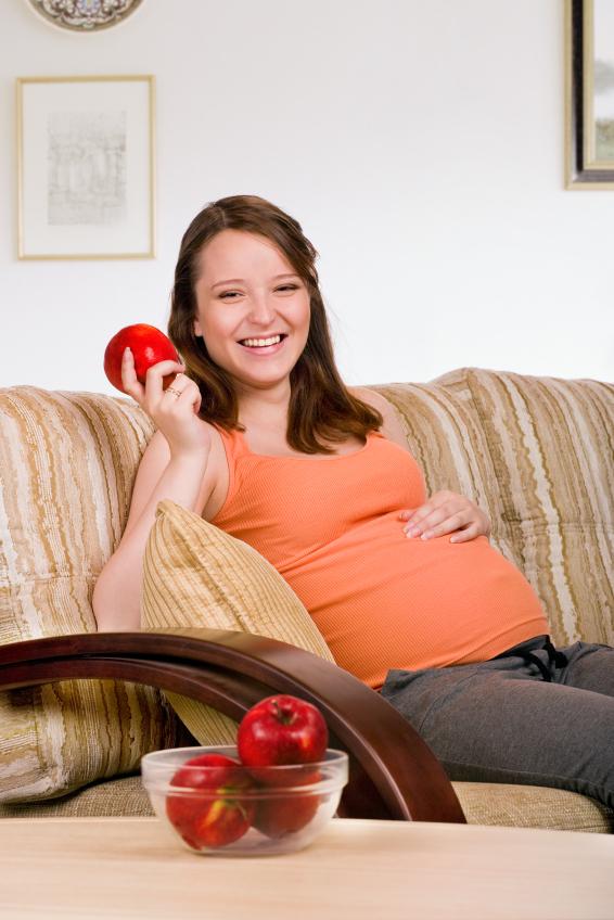 pregnant woman with apple