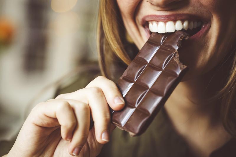 Woman eating chocolate