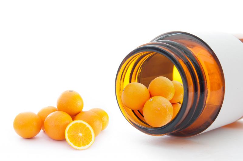 Oranges on medicine bottle representing vitamin c