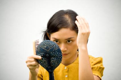 Woman looking at her scalp