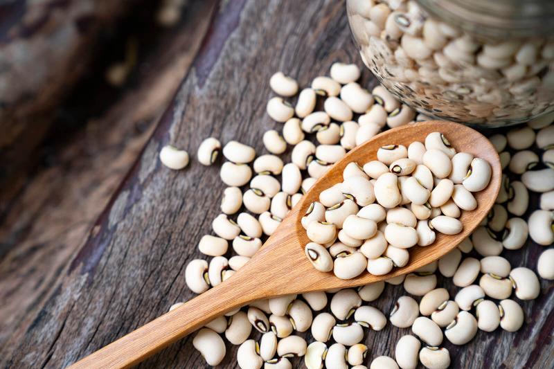 Soy beans on wooden spoon