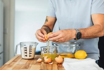 Man cracking an egg into a bowl