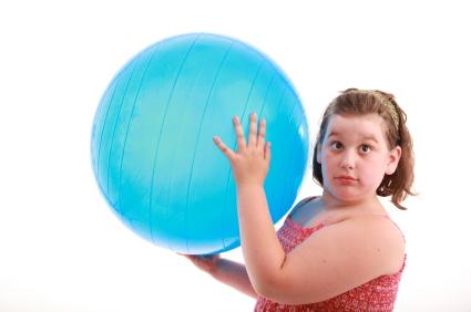 Obese Girl Using Exercise Ball