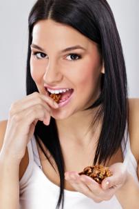 Woman eating nuts