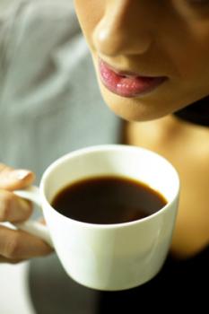 Woman about to sip her coffee