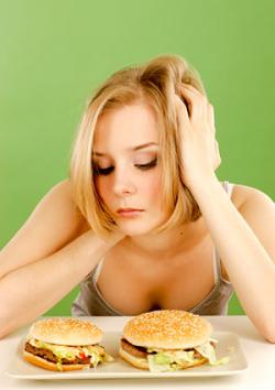 woman with two burgers