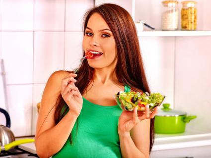 Woman eating salad