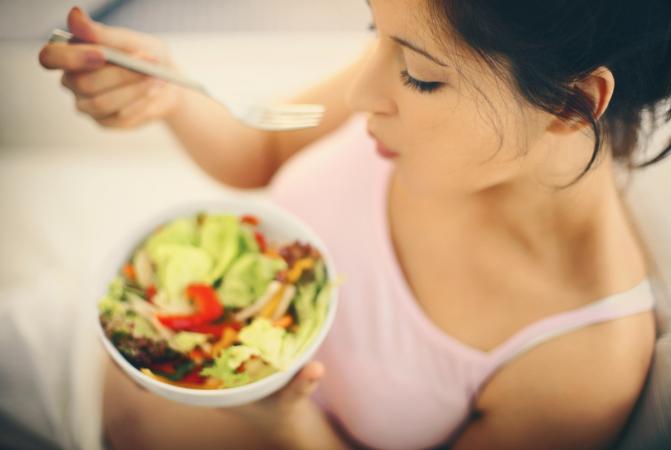 woman eating salad