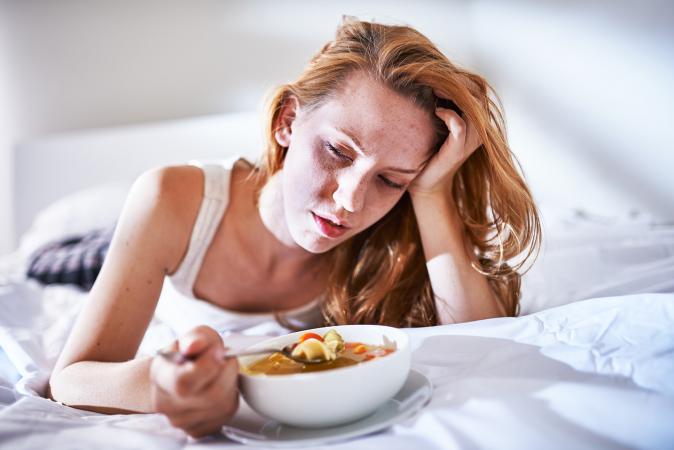 Eating chicken noodle soup when sick