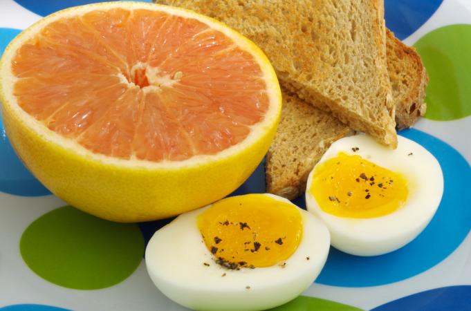 Grapefruit with eggs and toast