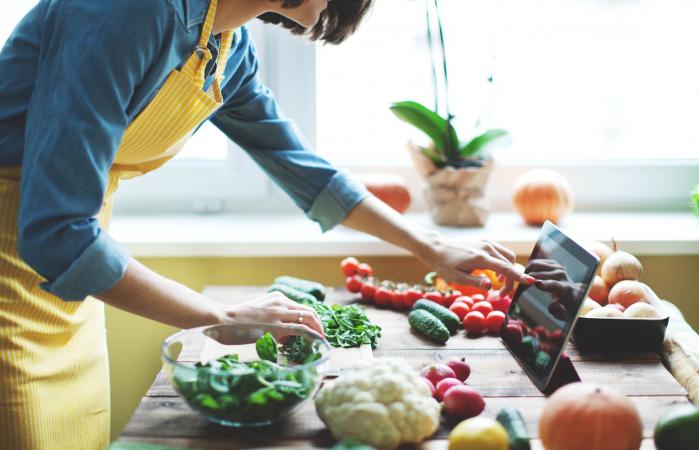 Woman cooking fresh vegetables