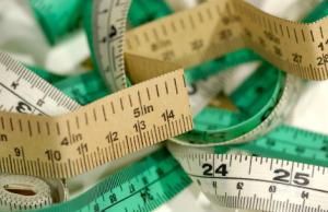 Multi-colored pile of tape measures