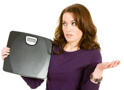 Woman struggling with weight plateau
