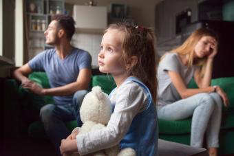 Frustrated little girl and parents fighting