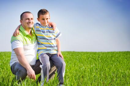 Man and child in wheat field
