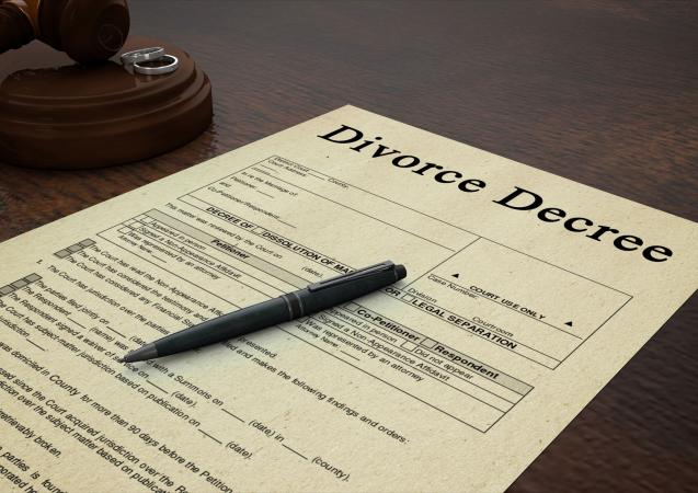Divorce decree paper with a pen