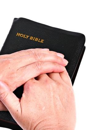 Hands_Over_Bible.jpg
