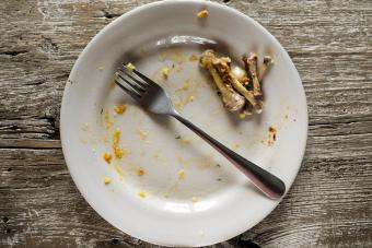 Dirty plate with leftover chicken bones