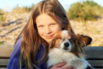 Girl and Papillon Dog