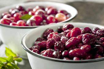 Two bowls of dried and fresh cranberries