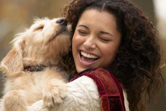Cheerful Woman Hugging Her Dog