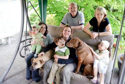 Two dog visiting with extended family