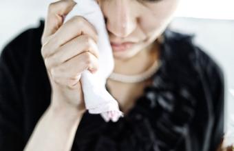 Bereaved crying at funeral