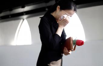 woman on mourning at funeral 