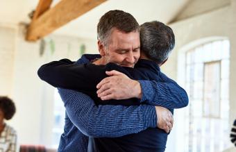 Man comforting a friend