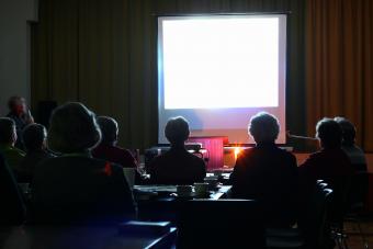 People looking at an evening presentation