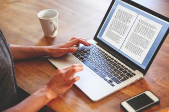 Female novelist writing on the laptop