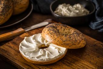 Poppy seeds bagel spread with cheese crams