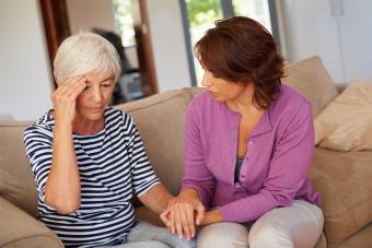 woman comforting mother after death of spouse