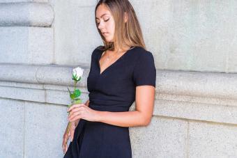 woman in black dress at memorial service