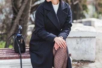 woman in black coat for formal memorial service