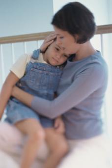 Mother comforting child