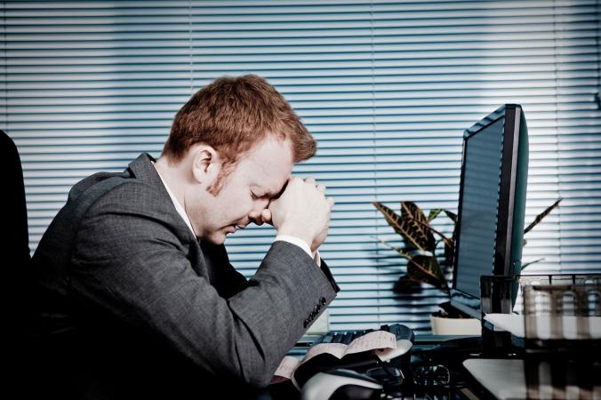 Grieving man at work