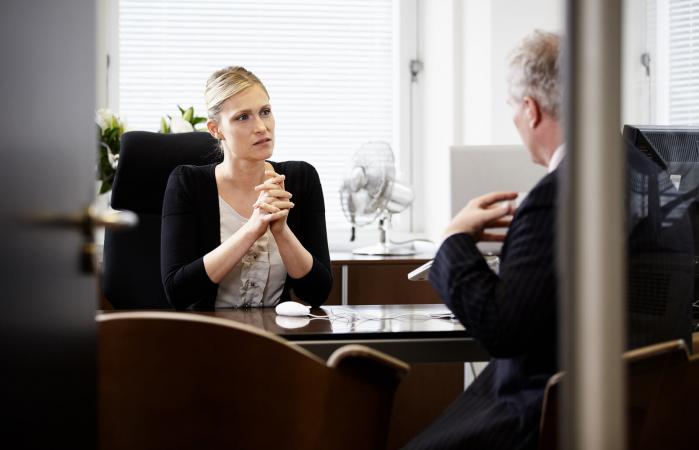 Colleagues talking in office