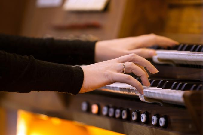 woman playing the organ