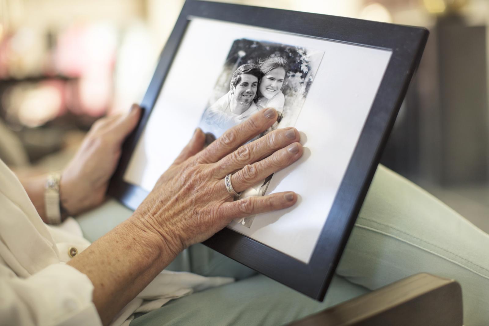 Senior woman holding a photograph