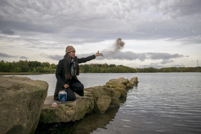 Woman scattering ashes