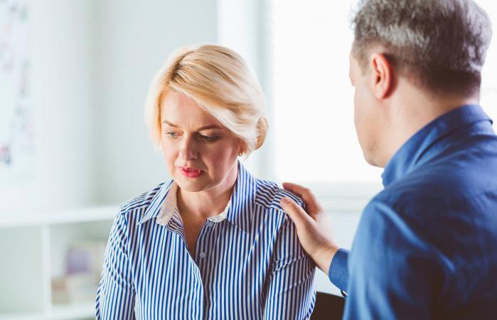 Depressed woman discussing with therapist