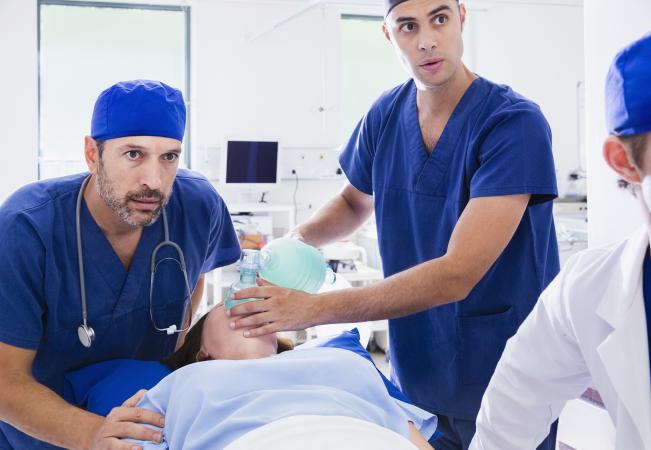 Doctors reviving patient